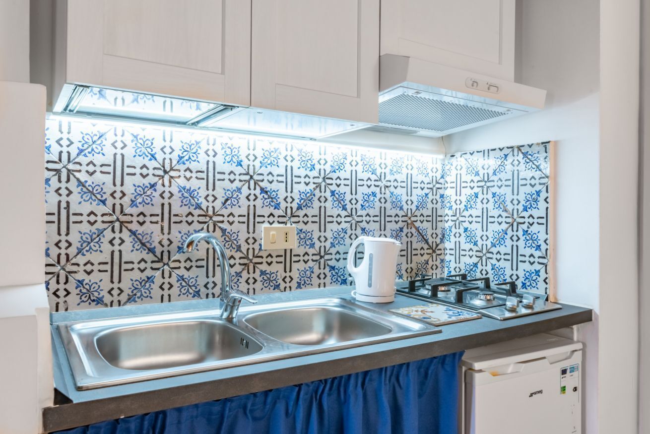 Fridge, microwave, stovetop, cookware/dishes/utensils