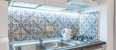 Fridge, microwave, stovetop, cookware/dishes/utensils