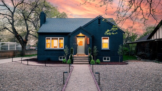 A two-story house with a dark blue exterior, a front entrance with a door and steps, and a number '333' displayed above the door. - Brick Haven House: King Suite, Near SUU, EV Charger, Parking, Nat’l Parks (Cedar City)