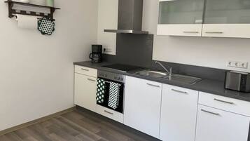 Apartment | Private kitchen | Oven, electric kettle, toaster