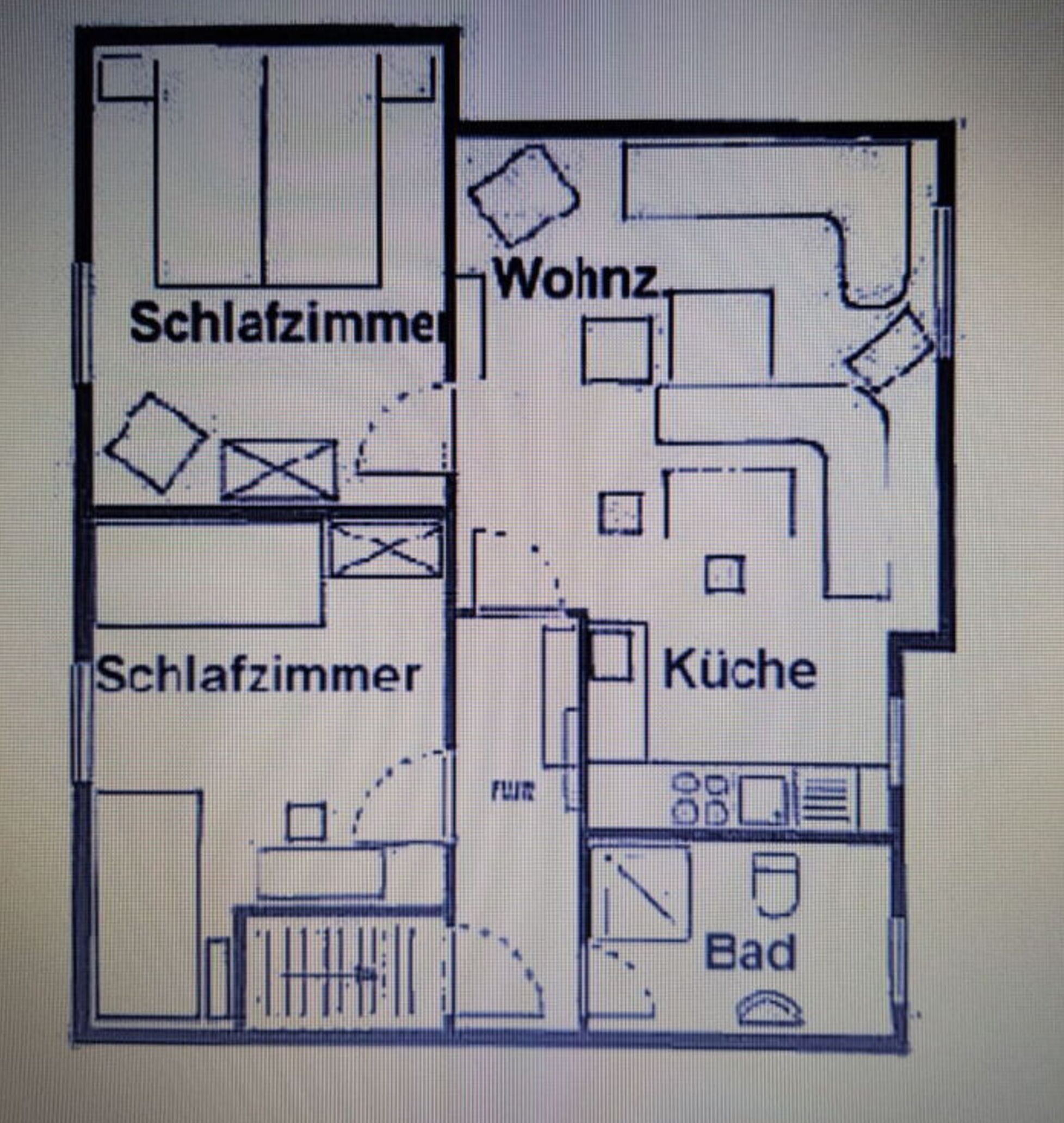 A floor plan with two bedrooms, a living room, a kitchen, and a bathroom.