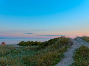 A beach path leading to the sea with a lifebuoy visible. - Amazing Holiday Home in the Nature-by Traum (Skummesloevsstrand)