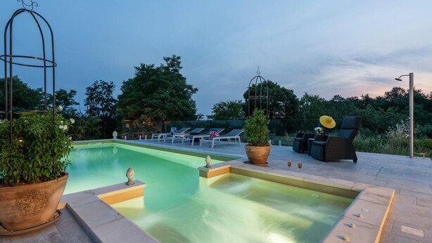 A rectangular pool with a hot tub, surrounded by lounge chairs and potted plants. - Modern Villa With Swimming Pool and Fenced Garden (Zminj)