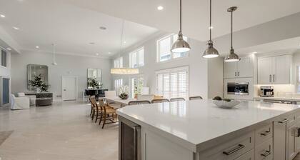 Spacious three-bedroom and two-bath home on the water with heated pool and spa