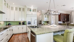 Fridge, microwave, oven, stovetop - This expansive home has seven bedrooms and five bathrooms. It is perfect for a family getaway or family reunion. (Marco Island)