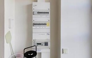 A utility panel with multiple circuit breakers and a control panel, indicating electrical infrastructure. - 4 Star Holiday Home in Tisvildeleje (Tisvildeleje)
