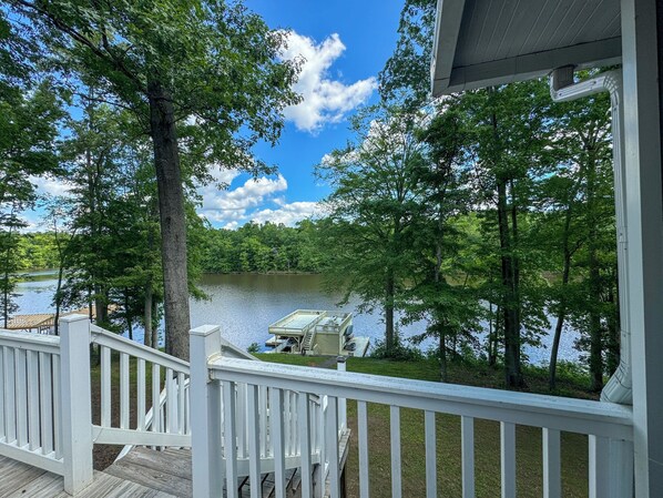 A lakeside property with a wooden deck and a boat dock. - Hyco Hills Hideaway- private location, close to VIR, fast wi-fi, HOT TUB (Semora)