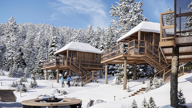 A wooden cabin with a deck and stairs, surrounded by snow-covered trees. - Beautiful Tree House in the Gailtal Valley (Kotschach-Mauthen)