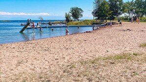 A beach with a swimming pool and a lifeguard stand. - 4 Star Holiday Home in Bergkvara-by Traum (Bergkvara)