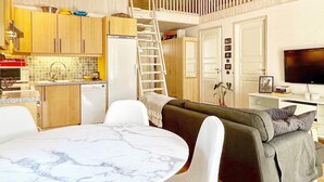 A modern living space with a kitchen, dining area, and seating area. - 4 Star Holiday Home in Bergkvara-by Traum (Bergkvara)