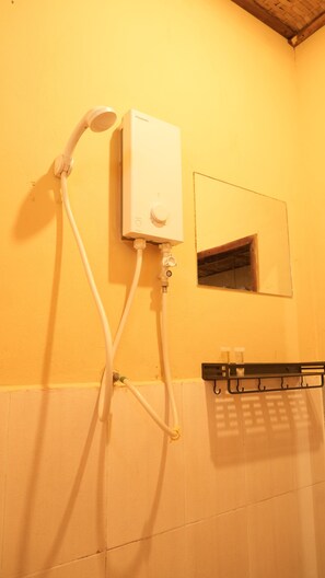 A bathroom with a shower unit mounted on the wall, a small window, and a towel rack. - Siem Reap Homesteading Garden Retreat (Siem Reap)