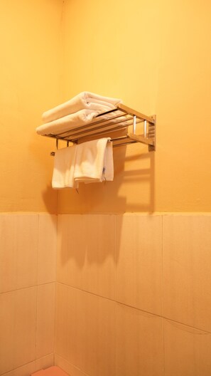 A bathroom with a towel rack holding two white towels. - Siem Reap Homesteading Garden Retreat (Siem Reap)