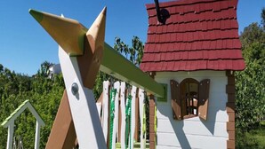 A small, colorful house with a red roof and a white and brown exterior. - Apartments Villa Subic - One Bedroom Apartment With Balcony A1 (Rab)