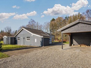A residential property with a detached house, a garage, and a shed. - 4 Star Holiday Home in Ansager (Ansager)