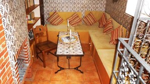 A cozy room with a sofa, a table with a tray, and a chair. - Pumpe an der Eider (Dellstedt)