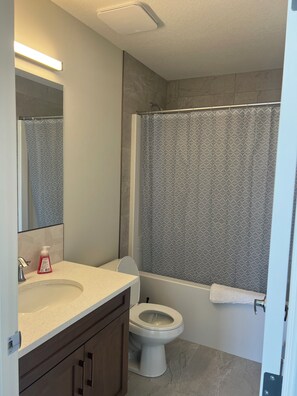 Shower, towels, soap, toilet paper
