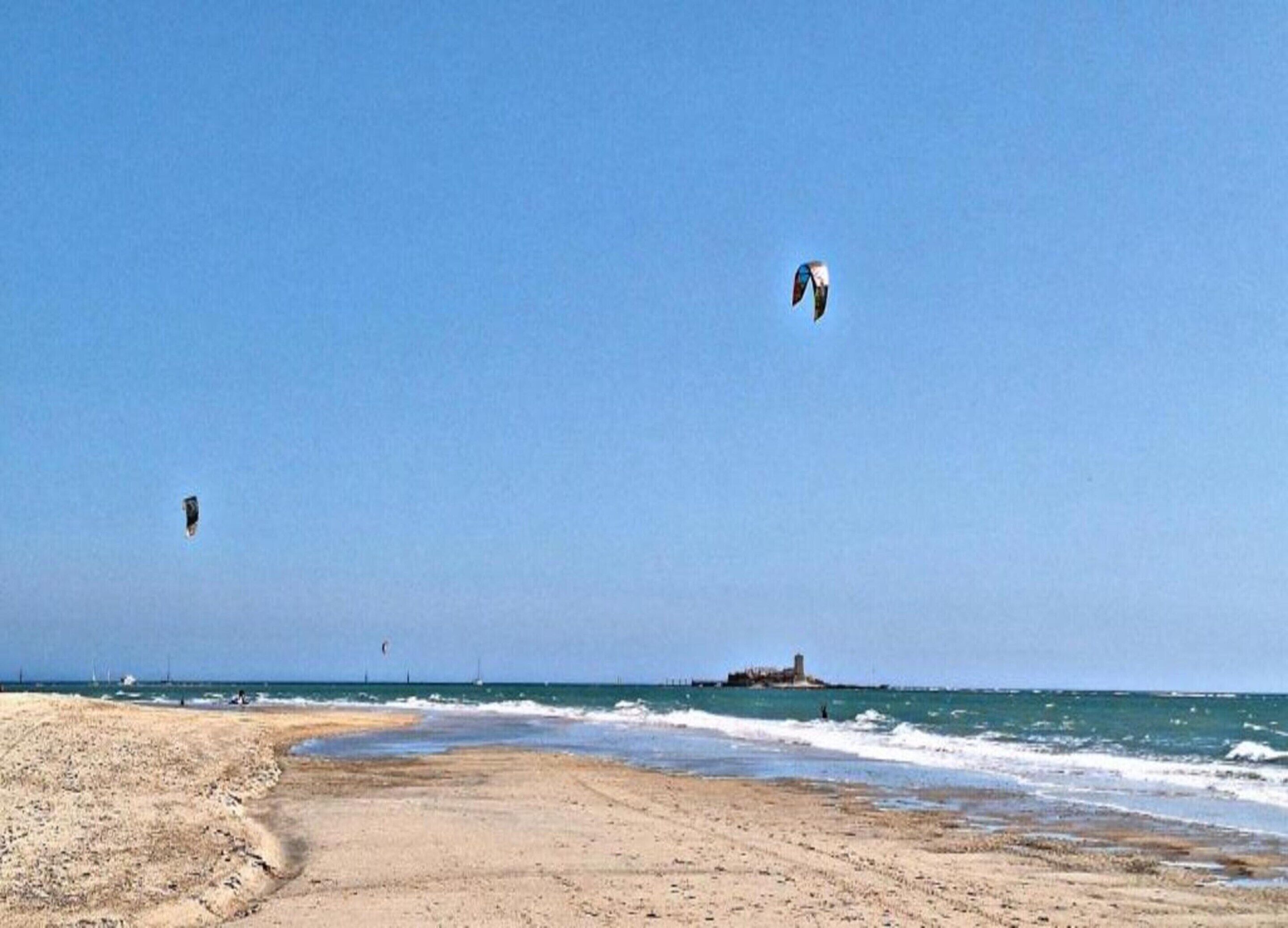 A beach with clear skies and calm waters.