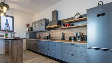 Villa | Private kitchen | Oven, electric kettle, toaster