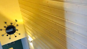 A staircase with wooden steps and a handrail, leading to a landing with a wall-mounted light fixture. - A gem of a Modern Retreat (Oberharz am Brocken)
