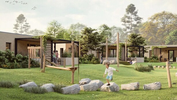 A modern outdoor play area with a wooden climbing structure and large rocks. - Holiday Home in Veluwe Near Nature Park (Voorthuizen)