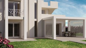 A modern two-story building with a flat roof, large windows, and a balcony with a geometric railing. - Holiday Home in Stintino Near Iconic Beaches (Stintino)
