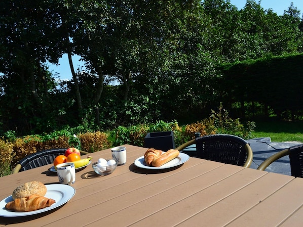Enjoy a peaceful breakfast amidst lush surroundings.