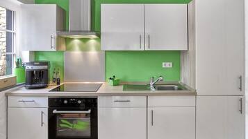 Apartment | Private kitchen | Oven, electric kettle, toaster