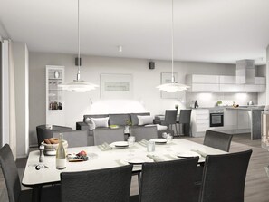 A modern kitchen with white cabinets, a dining area with a white table set for four, and a sofa in the background. - Holiday Home in Wendtorf (Wendtorf)