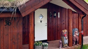 A rustic wooden cabin with a white door marked with the number 36. - 8 Person Holiday Home in Valldal (Fjord)