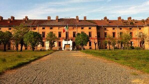 A large, historic building with a symmetrical facade, multiple windows, and a central entrance. - Holiday Home Casa Nanda (Mombaruzzo)