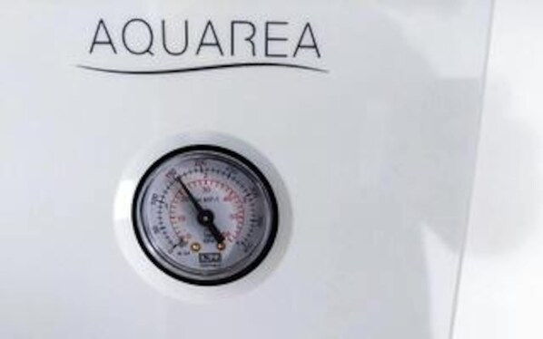 A gauge with the brand name 'AQUAREA' on a white surface.
