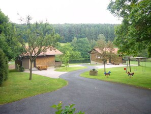 Surrounded by lush greenery, this serene setting offers a peaceful atmosphere perfect for relaxation and family fun.
