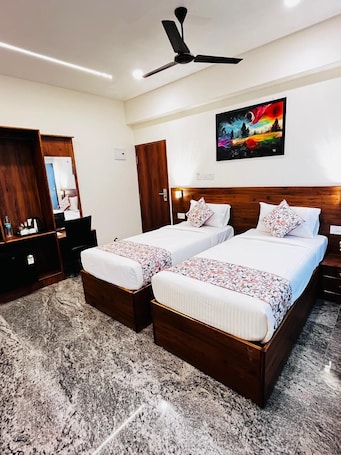 Deluxe Double or Twin Room, City View | Minibar, in-room safe, iron/ironing board, free WiFi