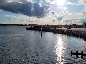 A waterfront with a dock, calm water, and a clear sky. - 4 Star Holiday Home in Faaborg (Faaborg)