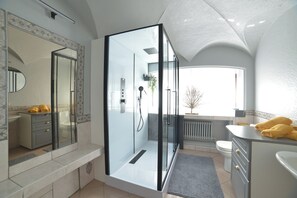 Shower, hair dryer, towels, toilet paper