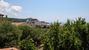 A coastal residential area with modern houses, lush greenery, and a view of the sea. - La Casa di Paolo Boutique Hotel (Camerota)
