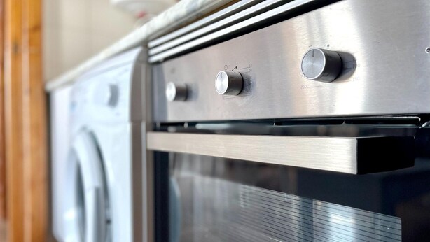 A stainless steel oven with a control panel and a built-in microwave. - Belvilla by OYO El Balandro (Roquetas de Mar)