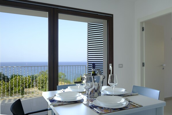 Deluxe Condo, Sea View | Living area | 32-inch flat-screen TV with digital channels