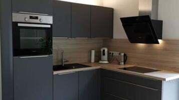 Apartment | Private kitchen | Oven, electric kettle, toaster