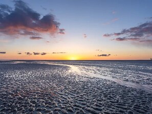 A beach with a sunset. - 4 Star Holiday Home in Blavand (Blavand)