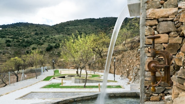 A water feature with a stone wall and a rustic pump. - Holiday Home in Laroya Near Centre (Laroya)