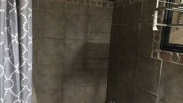 Shower, towels, soap, toilet paper