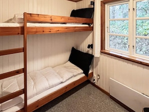 A bunk bed room with a window providing a view of trees. - 4 Star Holiday Home in Oster Assels (Øster Assels)