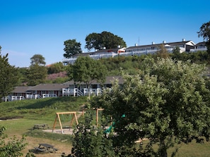 A residential area with houses, a playground, and picnic tables. - 7 Person Holiday Park Home in Aabenraa (Aabenraa)