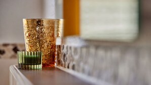 A glass with a textured design on a wooden surface. - Holiday Apartment "wetterstein" (Kruen)