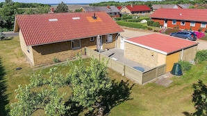 A residential area with houses featuring red-tiled roofs and brick construction. - 5 Person Holiday Home in Skjern (Skjern)
