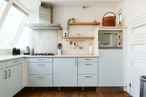 Bungalow | Private kitchen | Highchair - Holiday Bungalow With a Nice Light Appearance at 1.5 km From the Beach (Ouddorp)