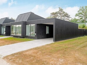 A modern building with large windows and a flat roof.