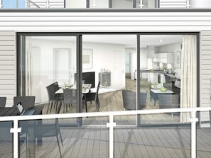 A modern interior with a dining area, kitchen, and a balcony with a view.