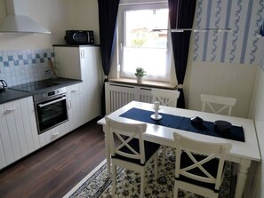 Apartment | Private kitchen | Oven, electric kettle, toaster, cookware/dishes/utensils - Holiday Apartment Randersacker (Randersacker)